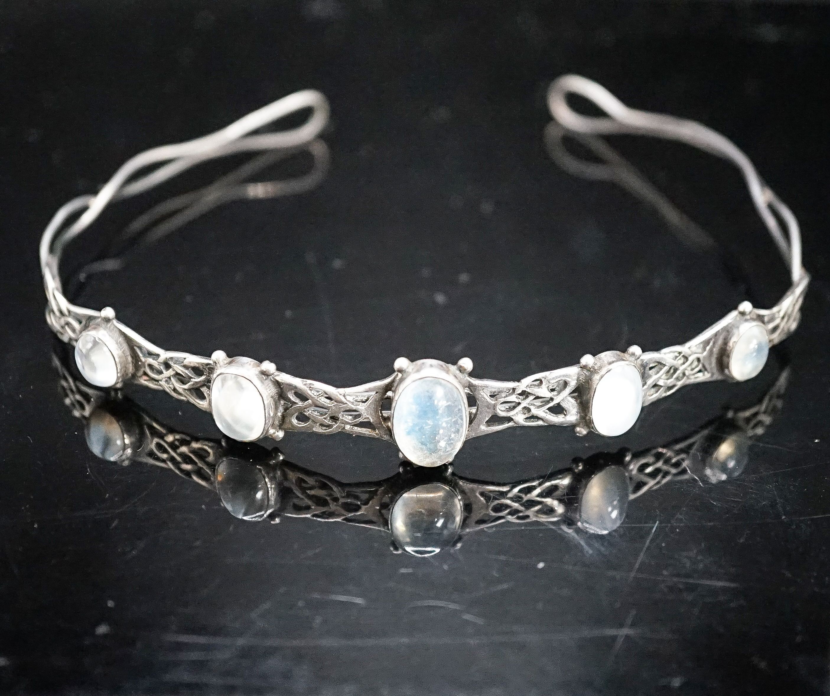 A white metal and graduated five stone cabochon moonstone set tiara, diameter 12.5cm